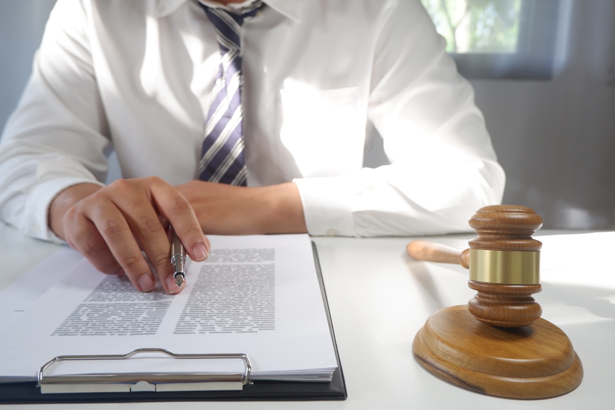 Legal counsel presents a contract with gavel and legal law. justice and lawyer concept