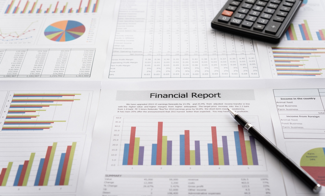 Graphs and charts analyzing how economic factors affect business.